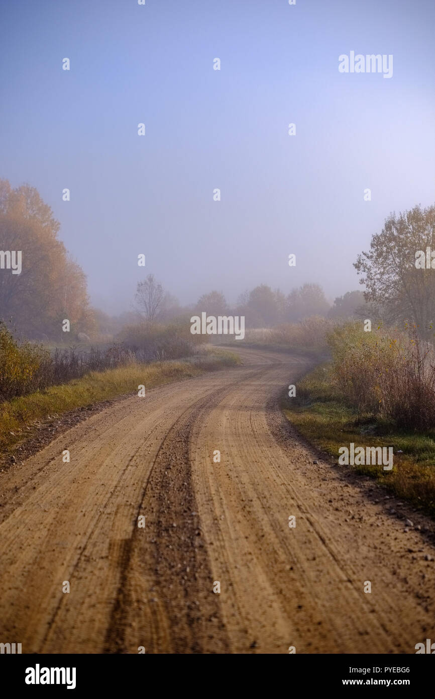 pleasing the senses or mind aesthetically country gravel road in autumn ...