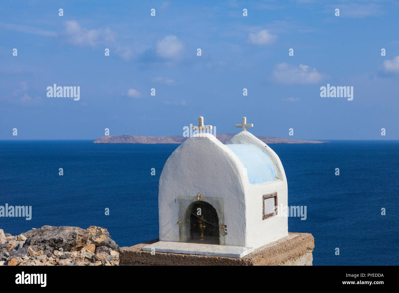 Typical greek miniature roadside shrine. Small Greek orthodox chapel in East Crete Stock Photo