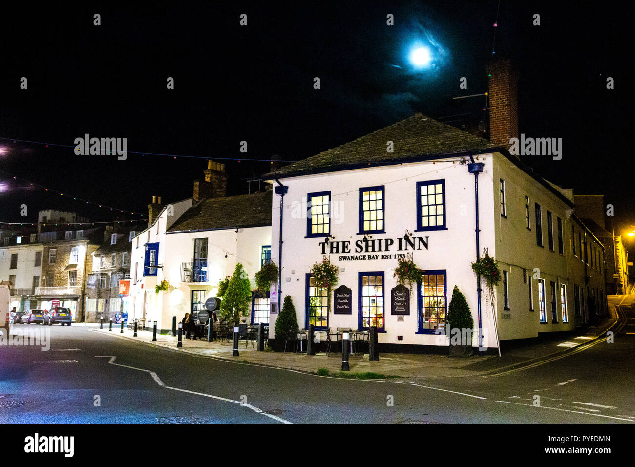 The Ship Inn and a street at night time in Swanage, Jurassic Coast, UK Stock Photo