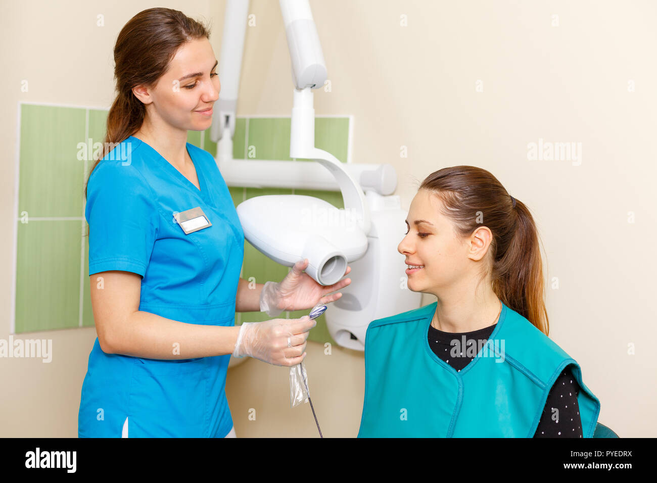 Dentist making x-ray for the female patient in the clinic Stock Photo