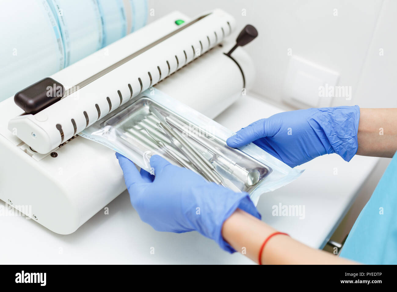 Sterilizing medical instruments in autoclave. Dental office. Dentist