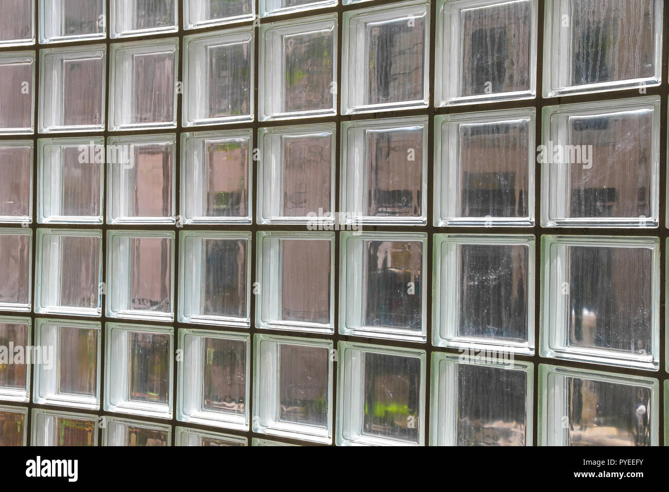 Closeup view on a wall made of glass tiles. Stock Photo