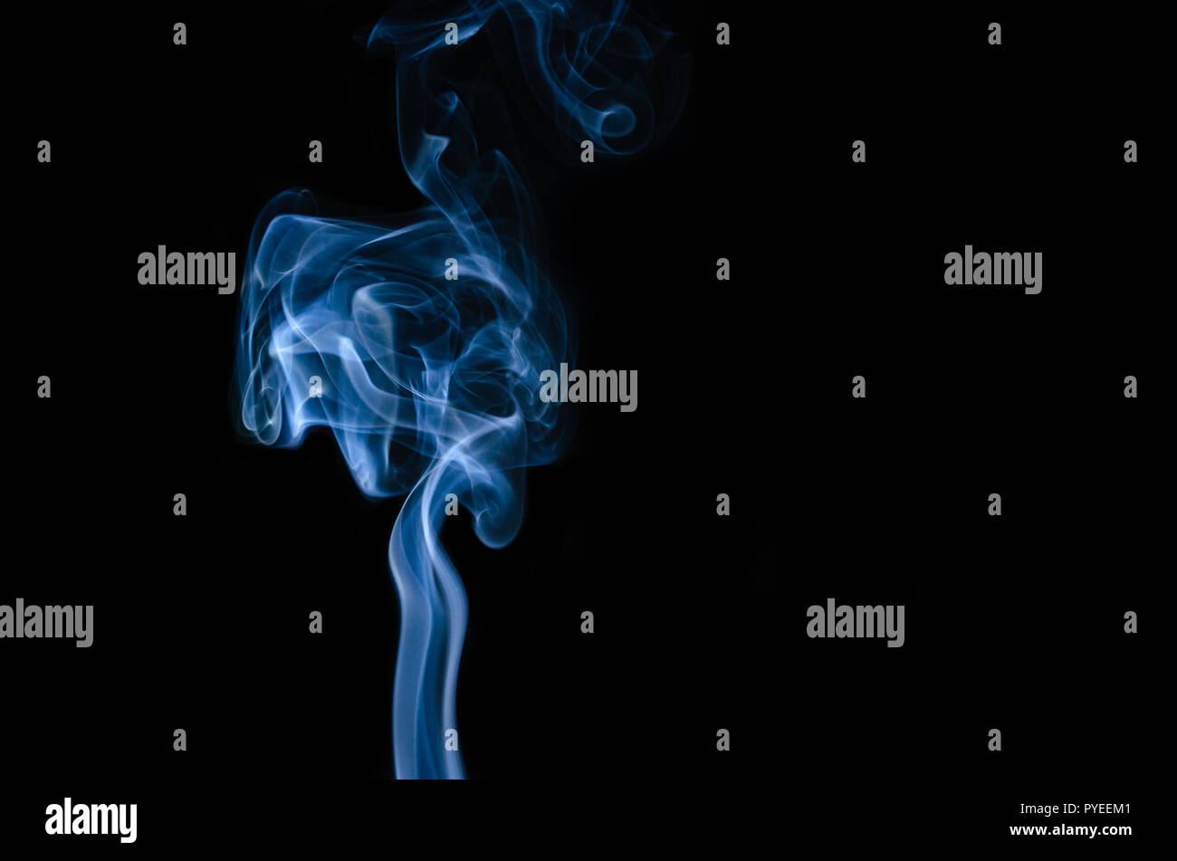 Movement of blue smoke isolated on black background Stock Photo - Alamy