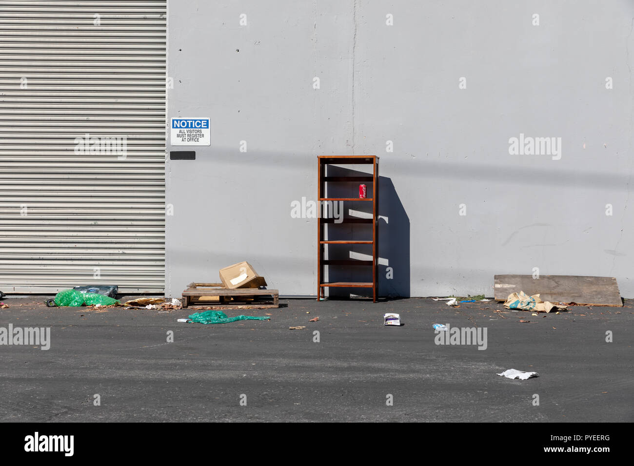 Waste in space behind industrial building; Sunnyvale, California, USA Stock Photo