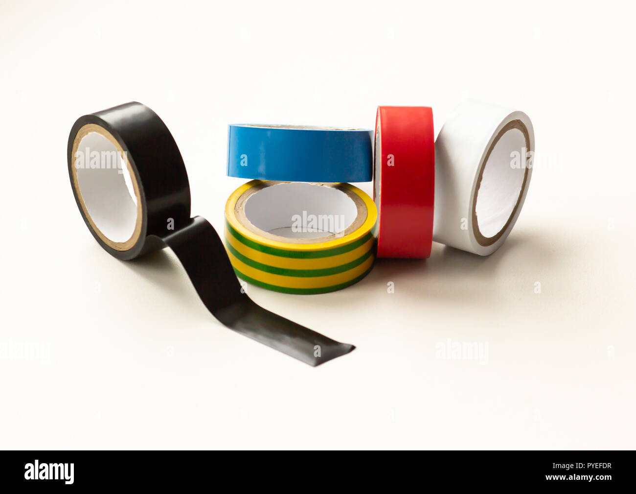 Multicolored insulating tape on a white background, close-up Stock Photo