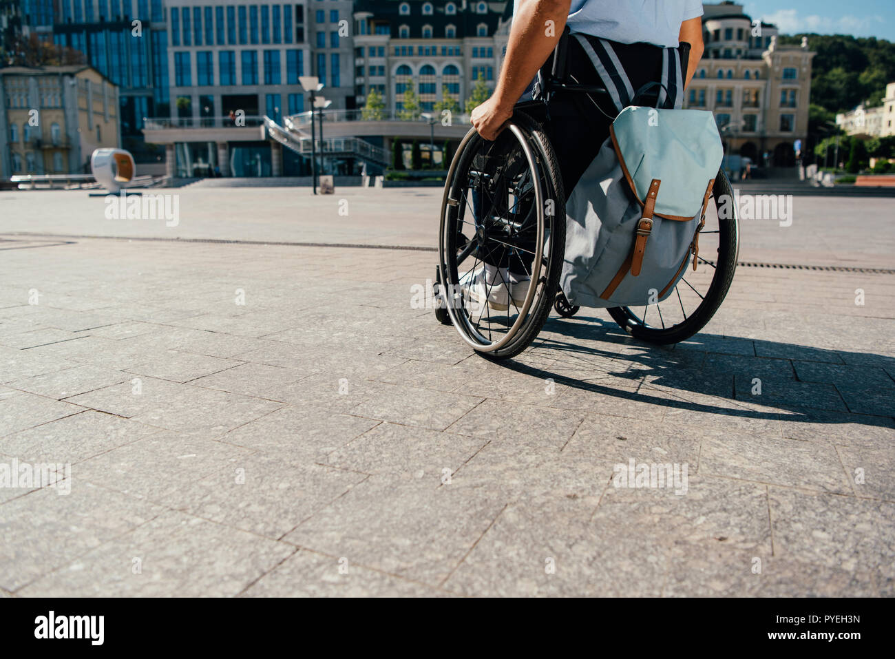 Young man wheelchair bag hi-res stock photography and images - Alamy
