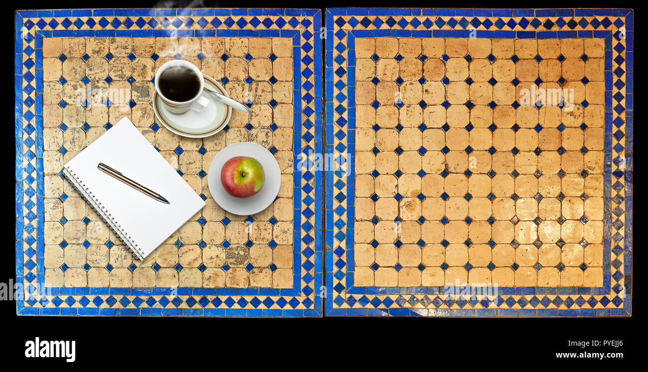 Notepad on Two moroccan mosaic table, view from above Stock Photo