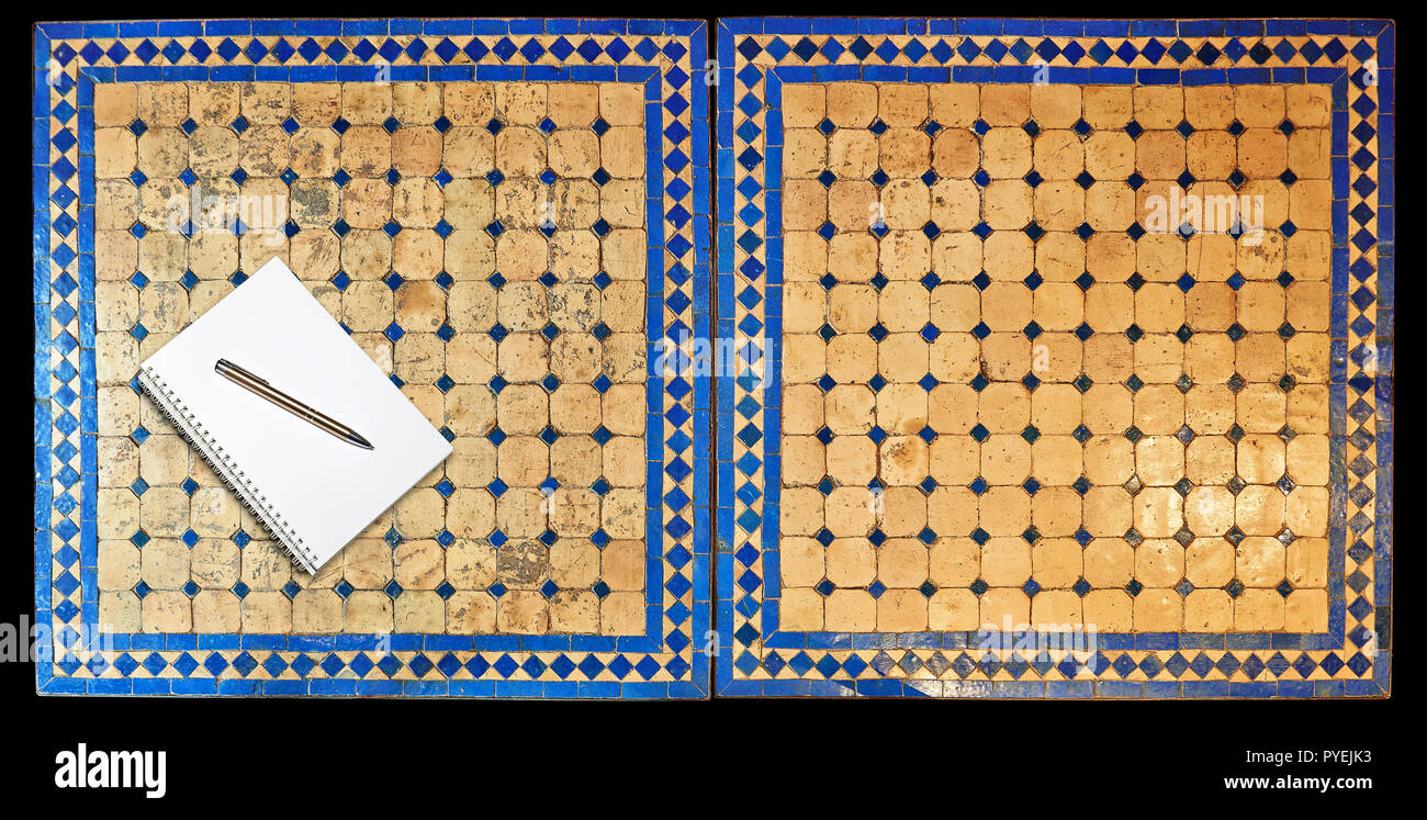 Notepad on Two moroccan mosaic table, view from above Stock Photo