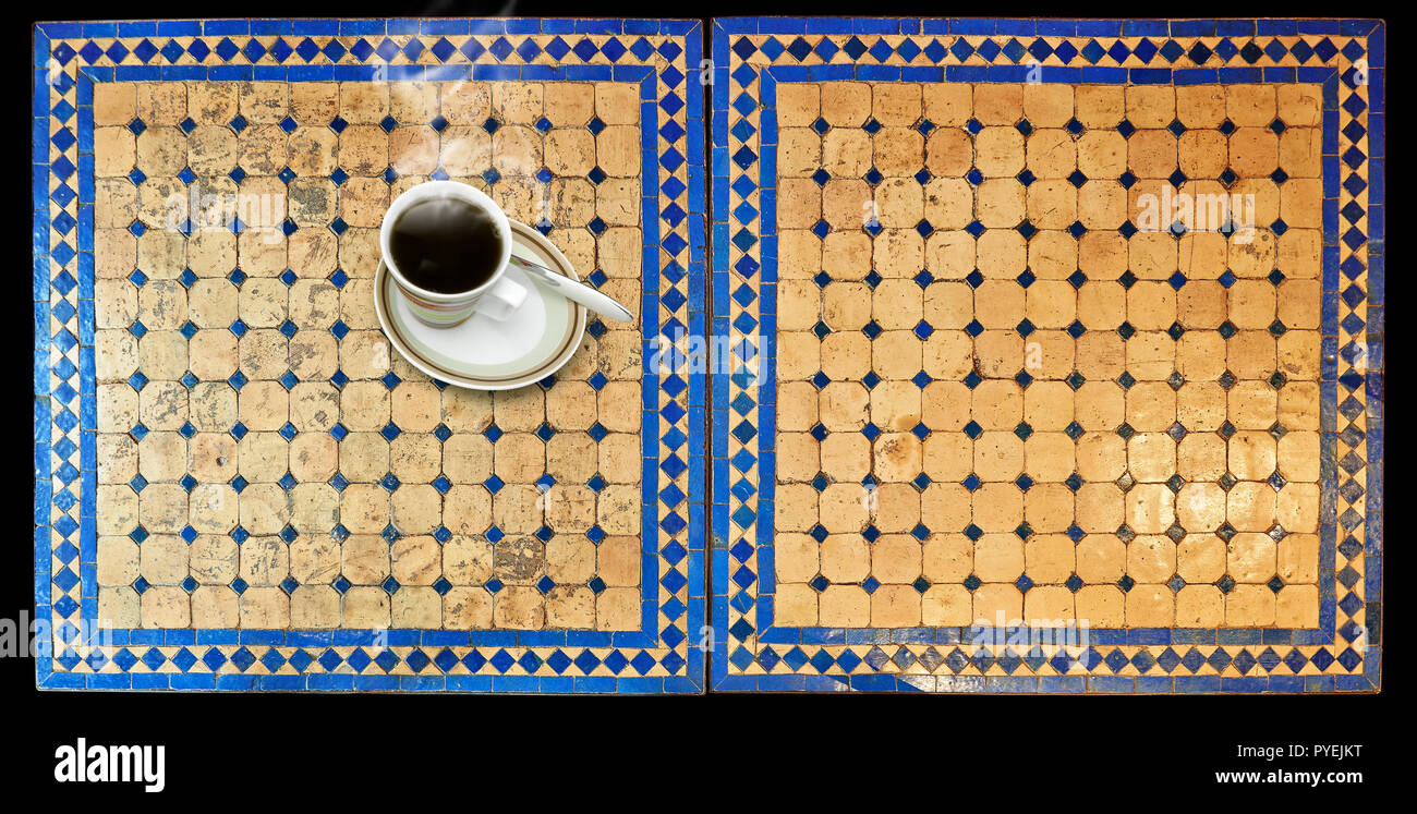 Cup of coffee on Two moroccan mosaic table, view from above Stock Photo