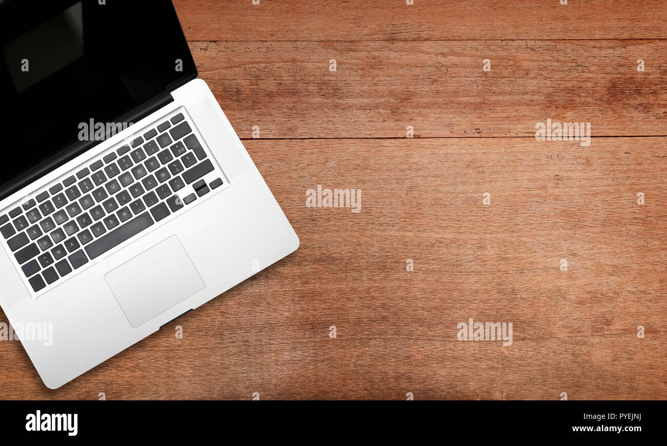 Notepad on notebook laptop on Wooden texture view from above Stock ...