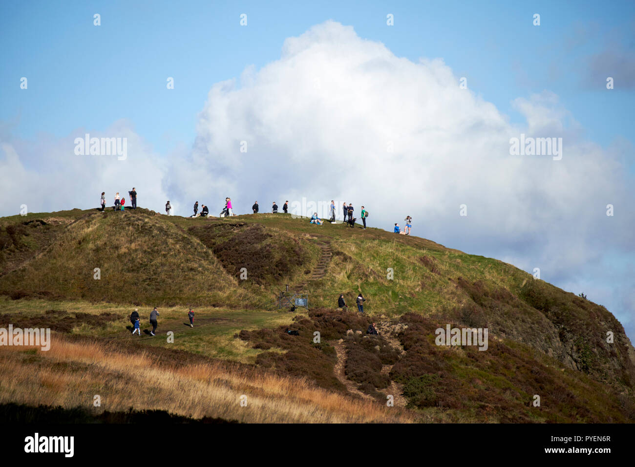tourists and walkers out on mcarts fort at the top of Cave Hill on a