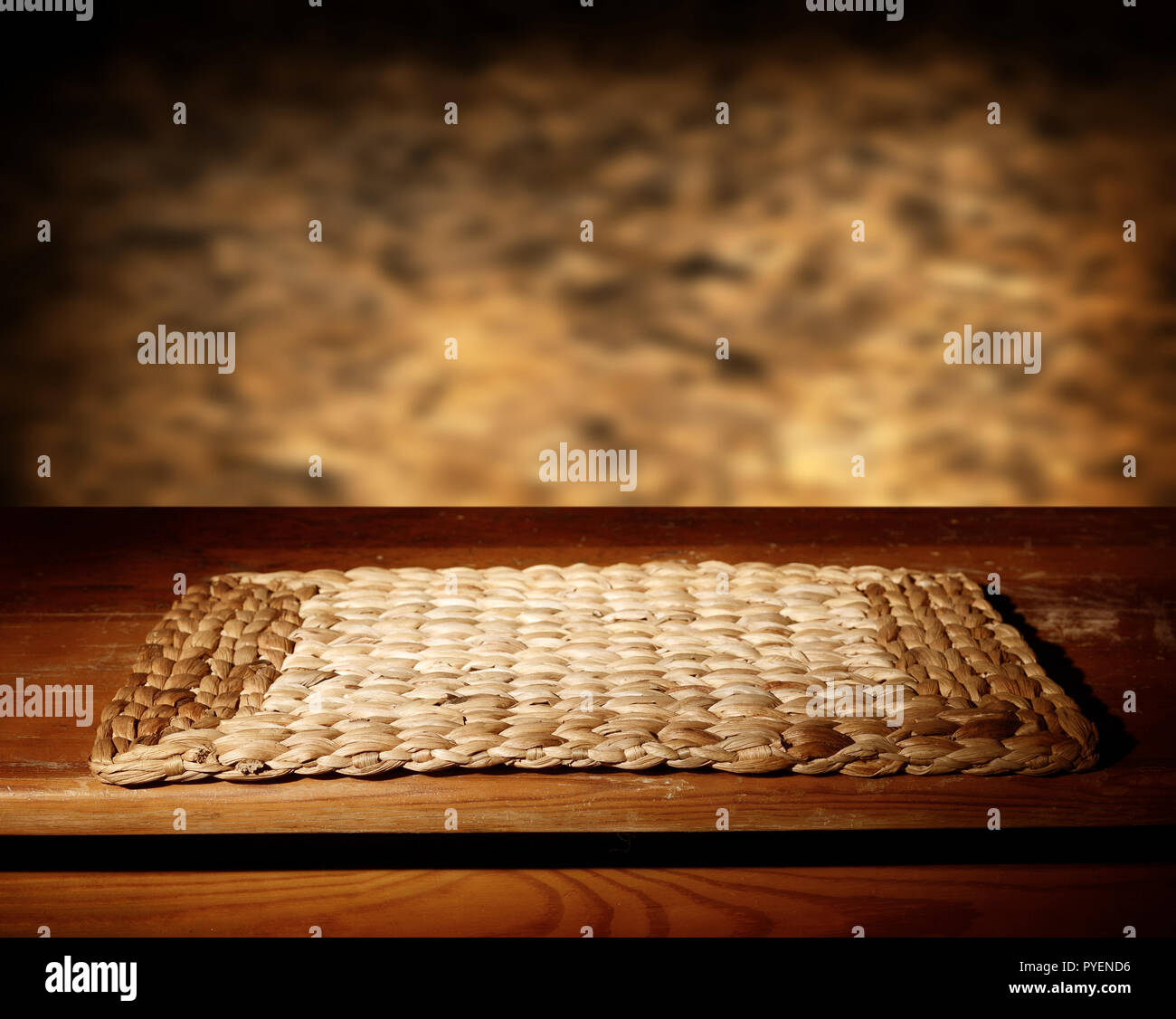 Empty wooden table and defocused brown wall Stock Photo