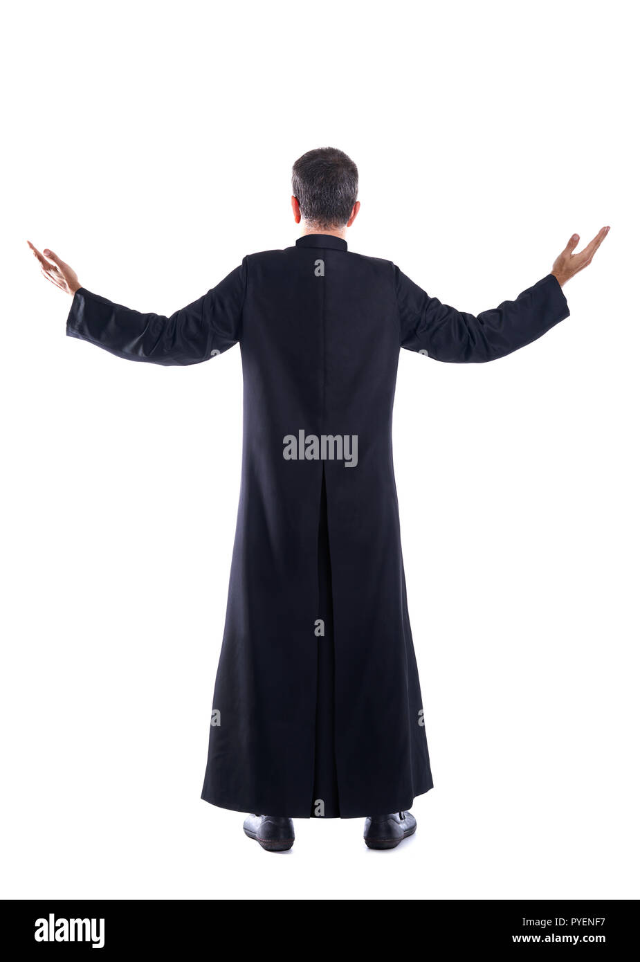 Full length priest blessing arm rear view of back soutane Stock Photo