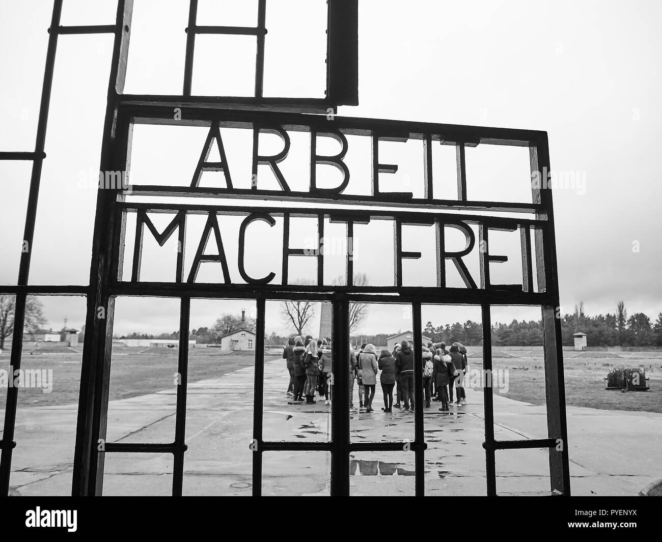 Orianenburg, Germany - December 12, 2017: Entrance gate of the Sachsenhausen Concentration camp. The door reports a sign saying 'Work sets you free'.  Stock Photo