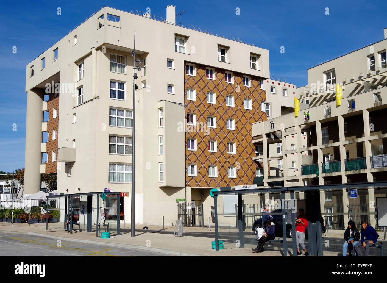 Cluster of 6 & 7 storey apartment buildings, opposite RER station