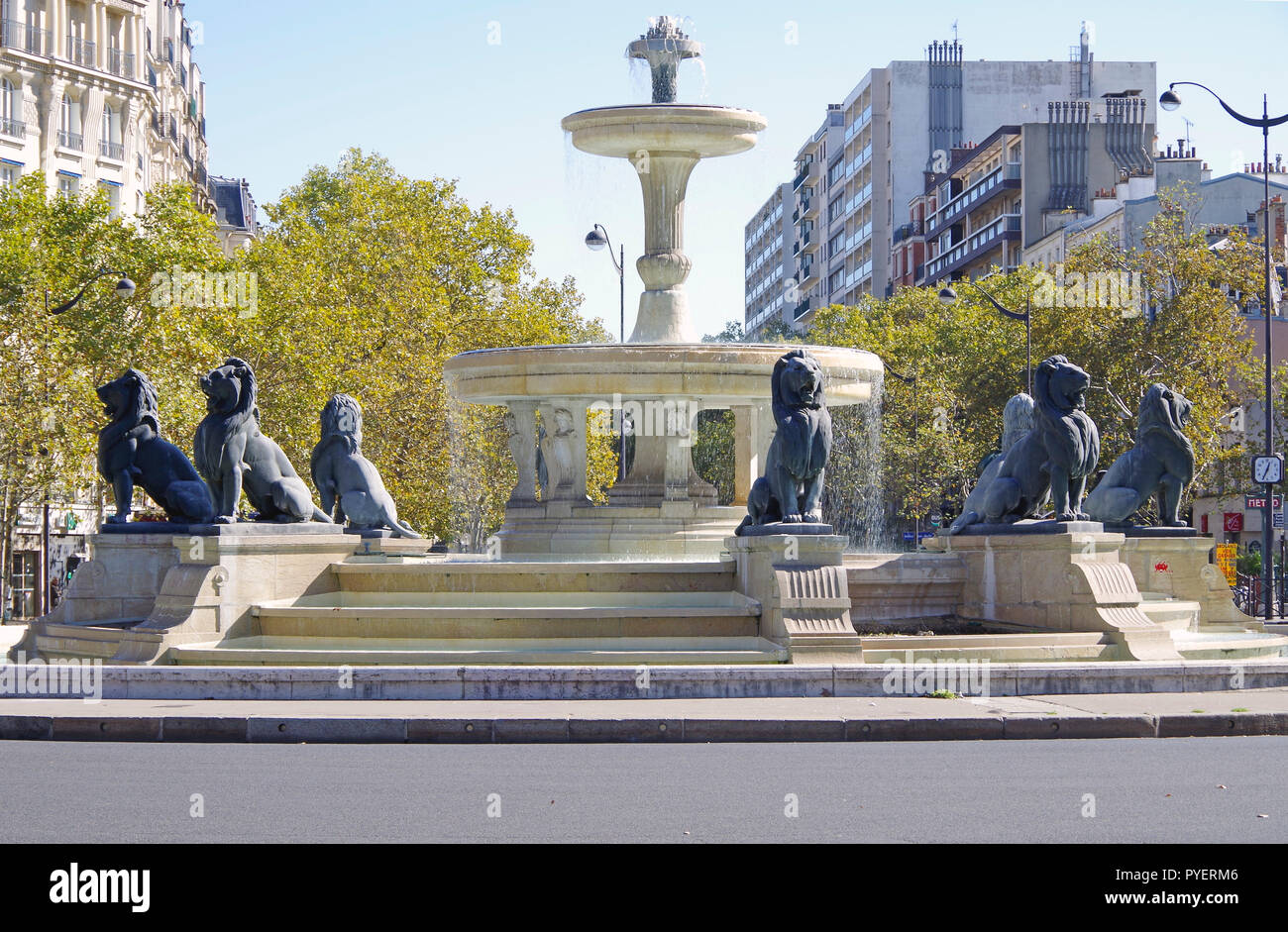 The Place Felix Eboué, Paris, basically a large roundabout, in its centre, a large circular fountain which includes eight large sculptures of lions Stock Photo