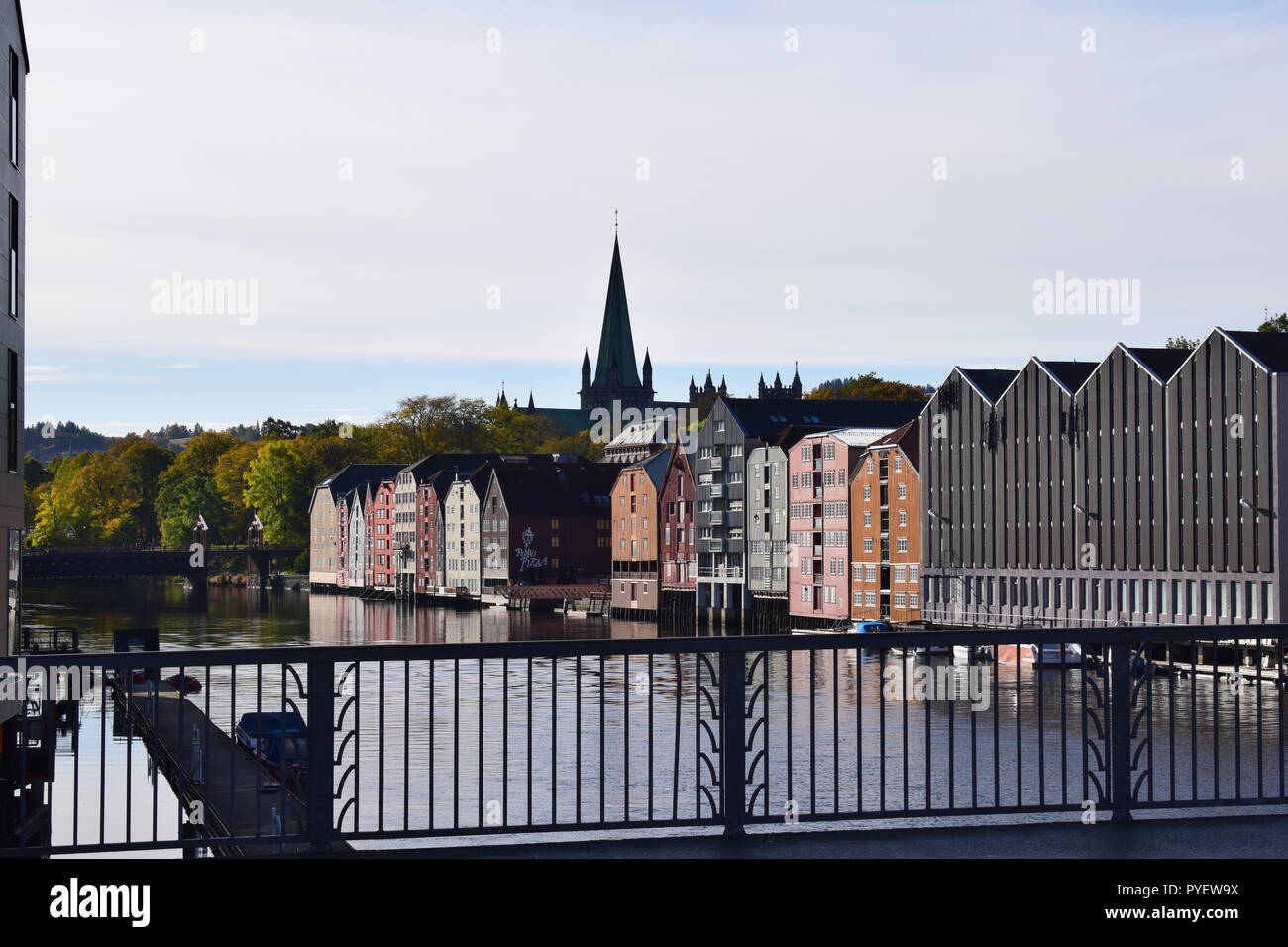A view from the bridge :Nidelva river with Nidaros Cathedral , Old Town Bridge and buldings along riveside, Tondheim , Norway. Stock Photo