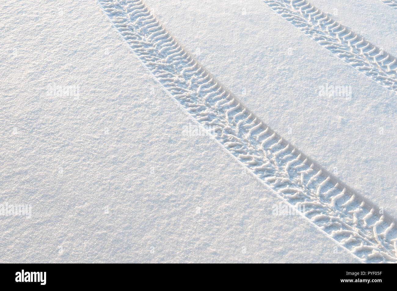 Car tire tracks in fresh snow Stock Photo - Alamy