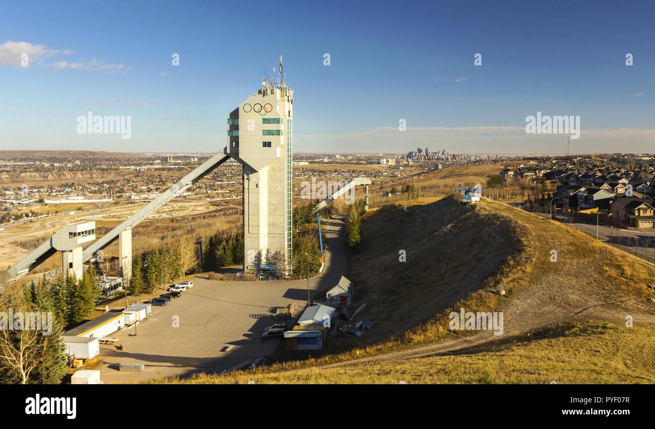 Ski Jumping Tower in COP Canada Olympic Park with City of Calgary Downtown Skyline Alberta Foothills Prairie Landscape Stock Photo