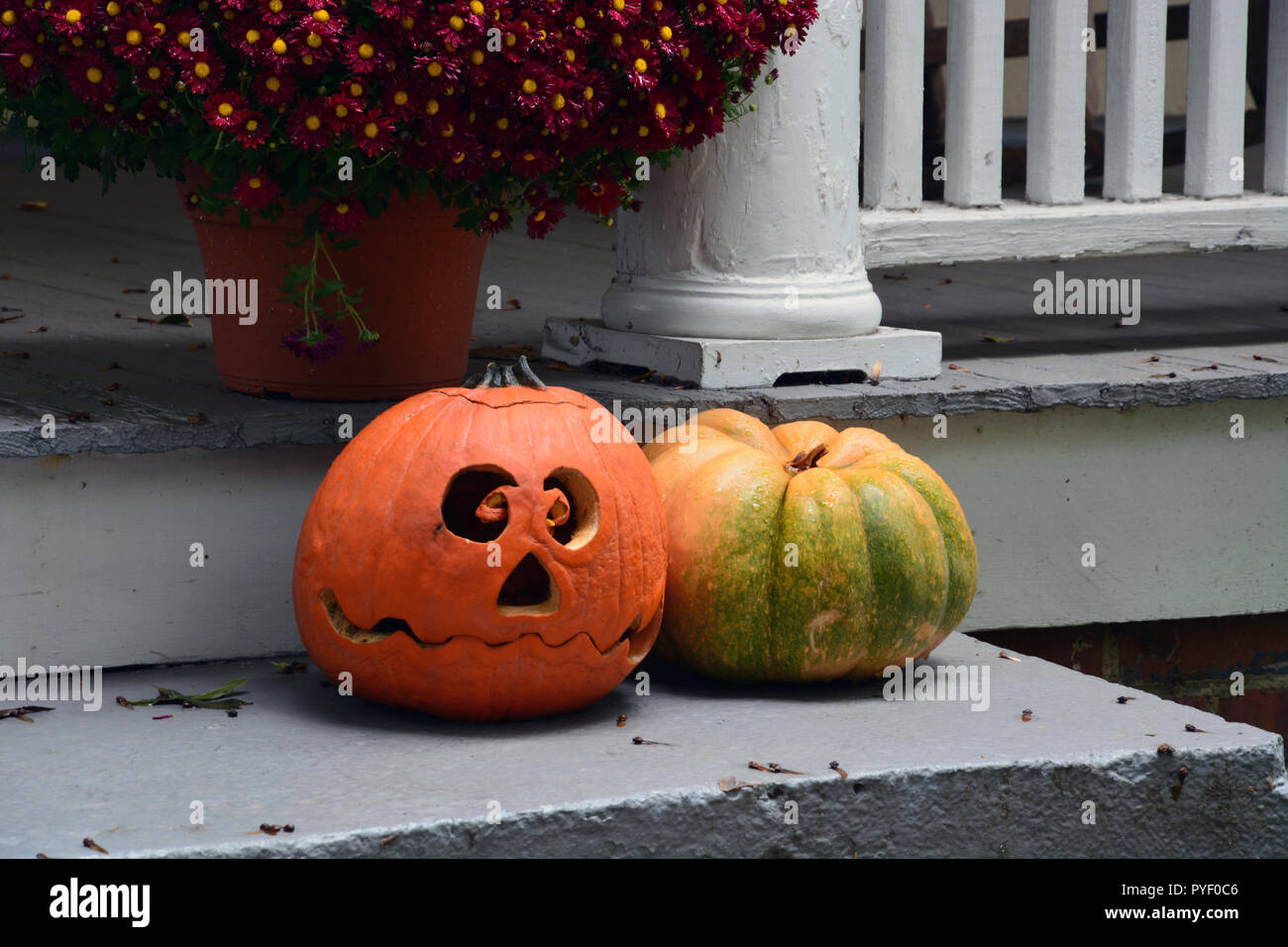 A jack-o-lantern on a front porch for Halloween Stock Photo - Alamy