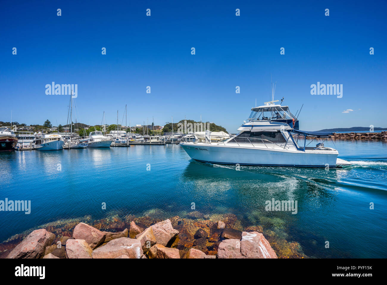 motor yacht entering Nelson Bay harbour, Port Stephens, Hunter Region, New South Wales, Australia Stock Photo