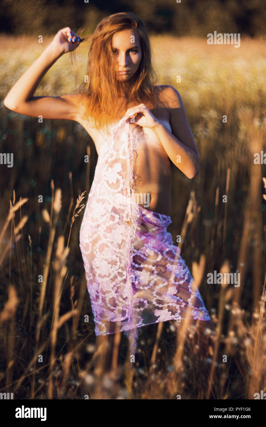 young naked beautiful flat Breasts Attractive young woman with naked slim body standing posing in a summer  meadow on sunset covering her small breasts and hips with silk scarf Stock  Photo - Alamy