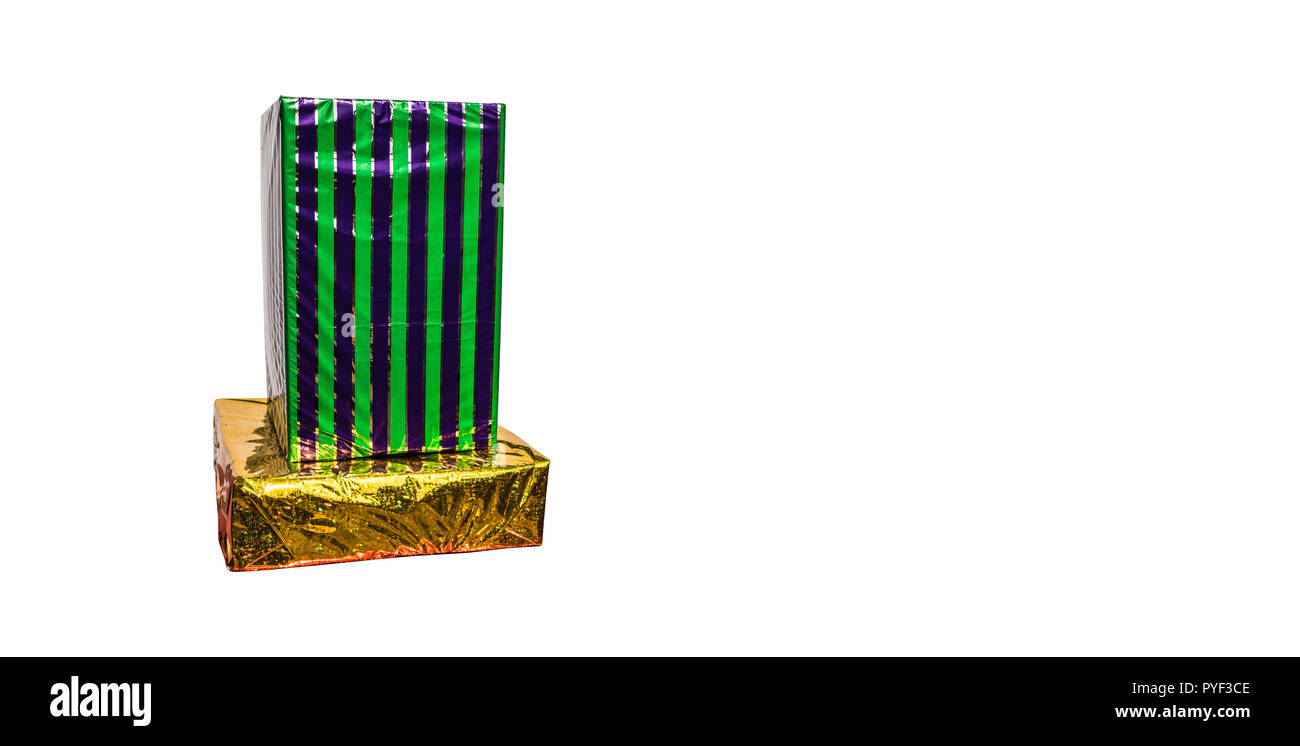 A stack of wrapped gift boxes in green and gold on a white background ...
