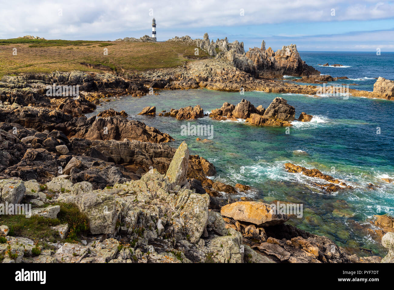 Ushant island sharp coastline and Creach lighthouse, Brittany, France Stock Photo