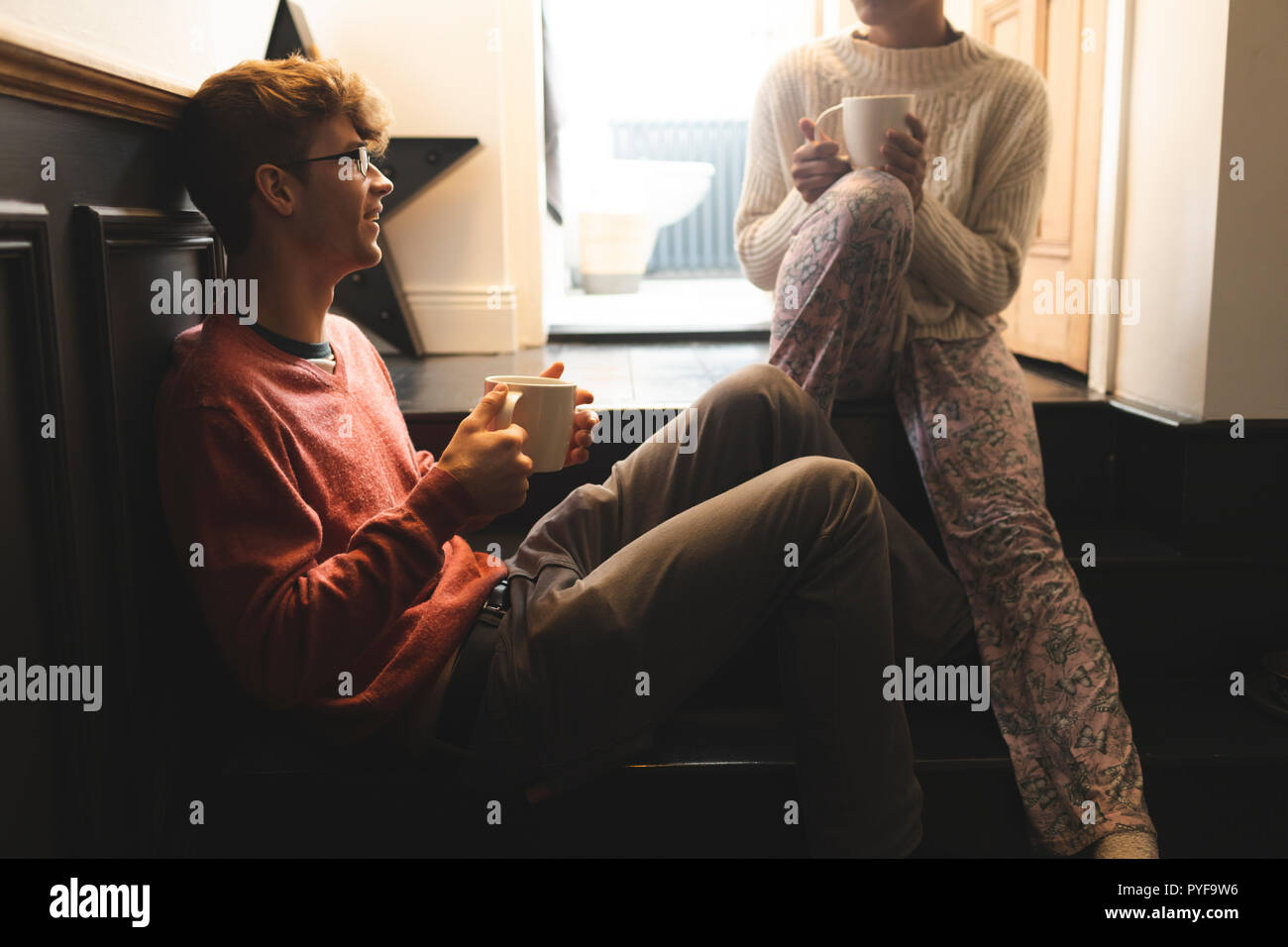 Couple interacting with each other while having coffee Stock Photo