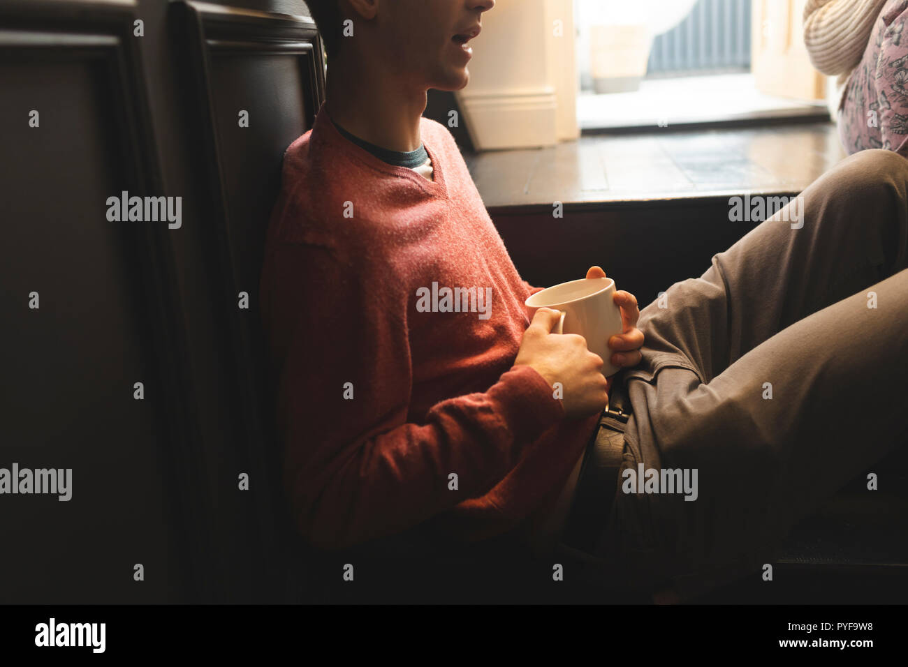 Couple interacting with each other while having coffee Stock Photo