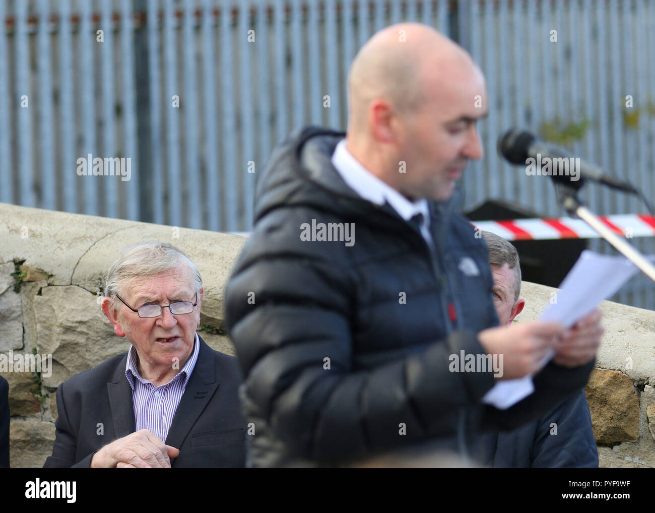Billy Begley the father of Shankill bomber Thomas Begley listens to former PIRA member Sean Kelly, right, speak at Milltown Cemetery in West Belfast, as Hundreds of people from across the communities of Northern Ireland have come together for a church service to mark the 25th anniversary of the Shankill bomb. Stock Photo