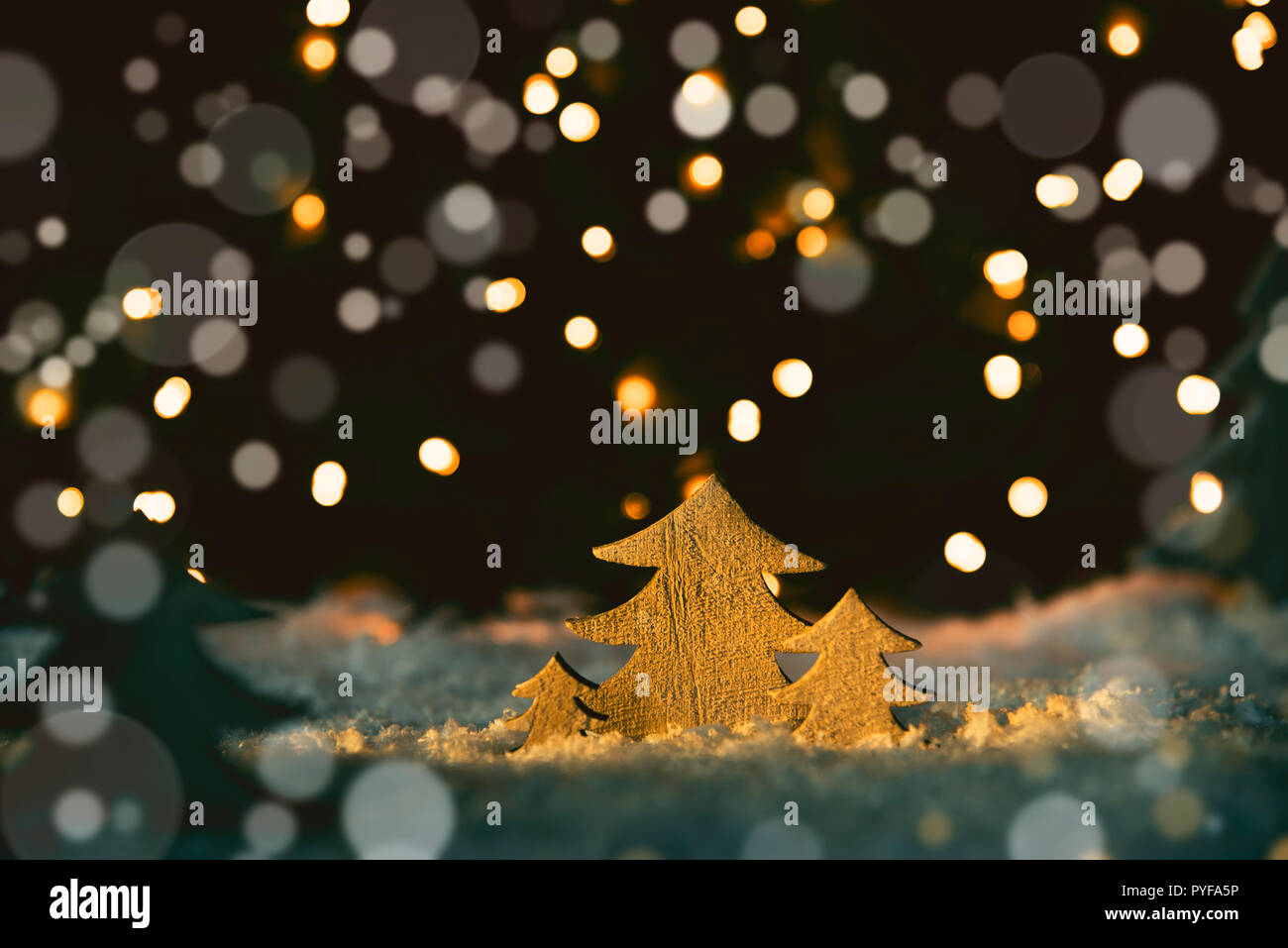 Wooden Christmas Trees, Snow, Magic Bokeh And Lights Background Stock Photo Alamy