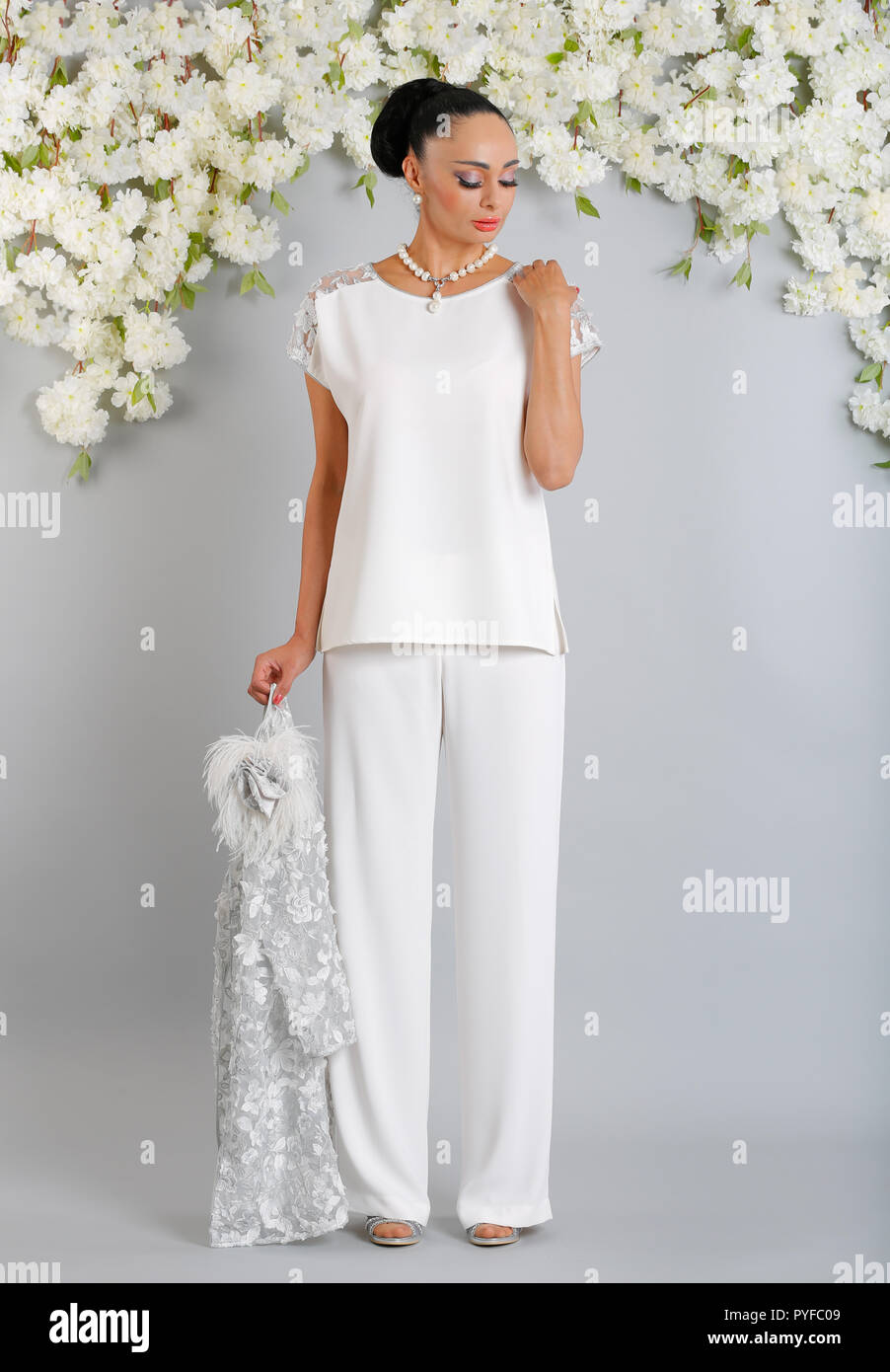 LUIS CIVIT Spanish designer collection from Barcelona covering all aspects  of special occasion wear, mother of the bride outfits with hats to match  Stock Photo - Alamy