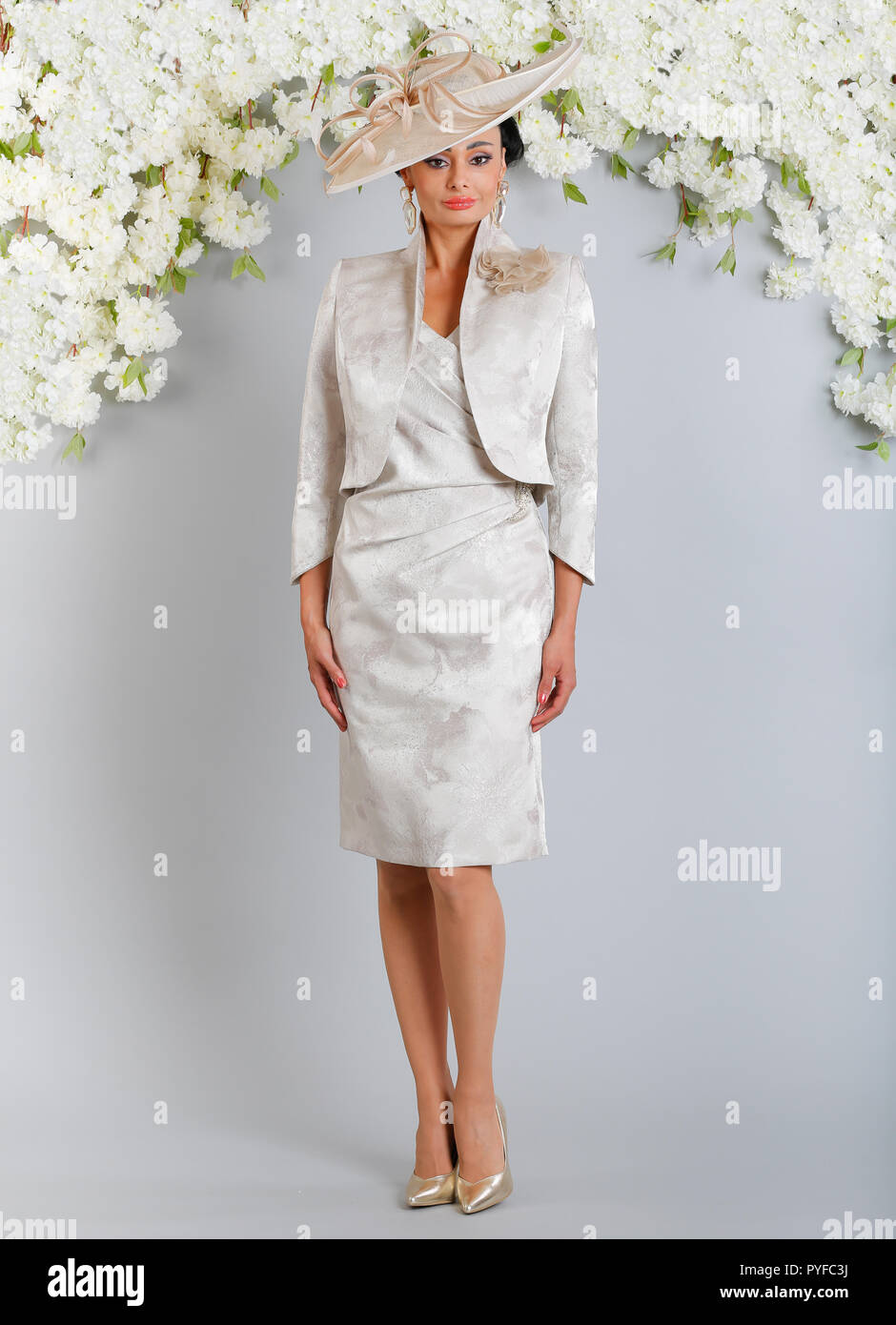 LUIS CIVIT Spanish designer collection from Barcelona covering all aspects  of special occasion wear, mother of the bride outfits with hats to match  Stock Photo - Alamy