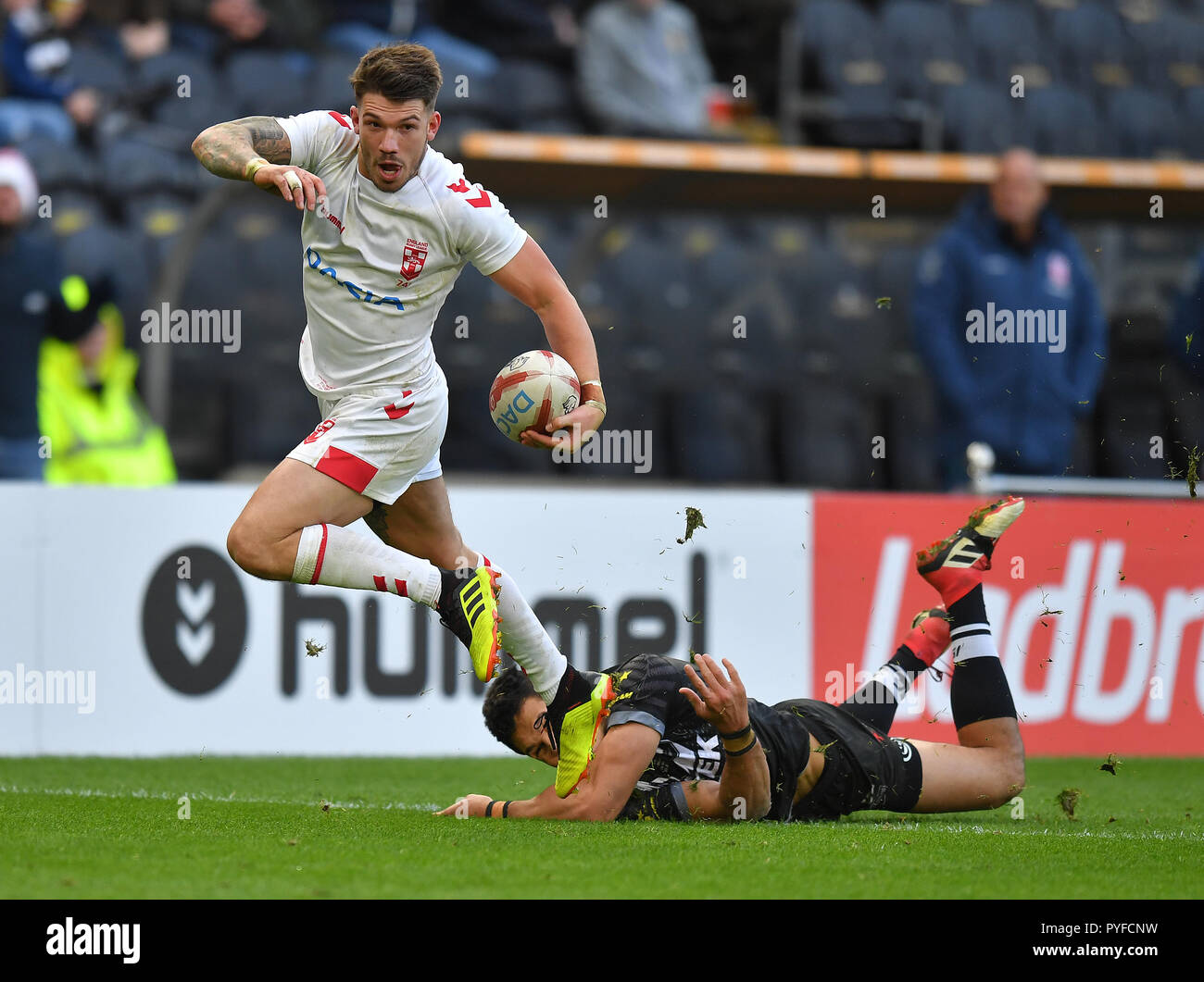 England's Oliver Gildart evades a tackle to score his team's 3rd try during the International Friendly at The KCOM Stadium, Hull. Stock Photo