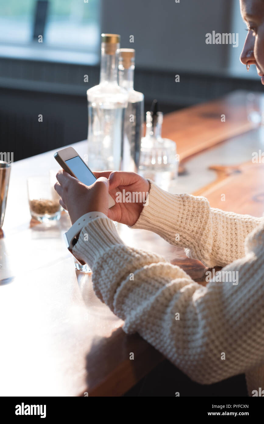 Female worker using mobile phone Stock Photo