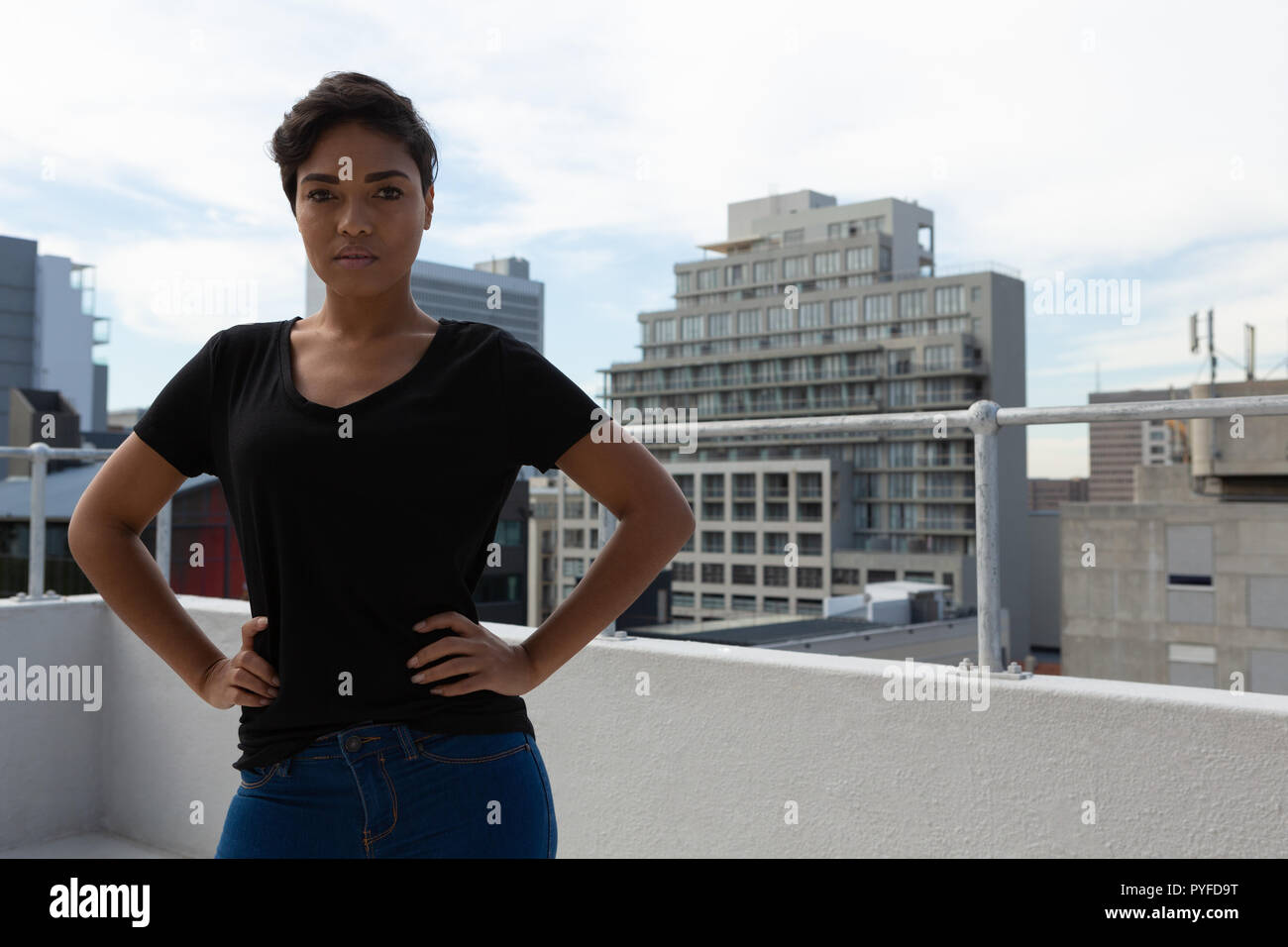 Model posing on terrace Stock Photo