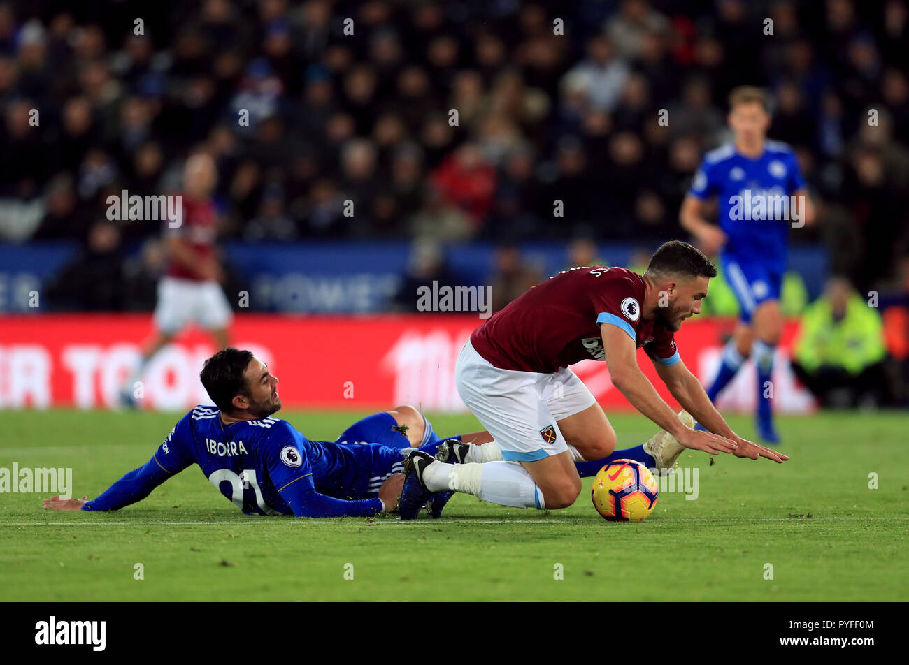 Leicester City's Vicente Iborra (left) and West Ham United's Robert Snodgrass battle for the ball during the Premier League match at The King Power Stadium, Leicester. Stock Photo