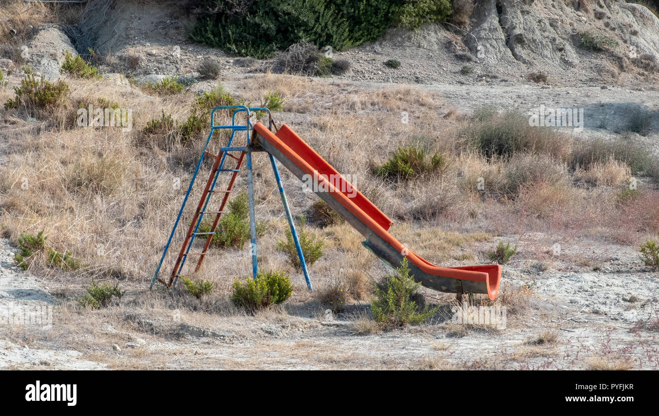 abandoned and derelict playground and swing near Rhodes, Greece Stock