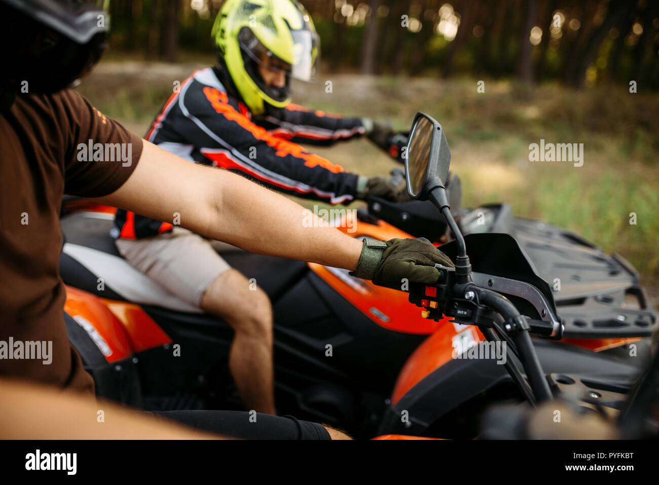 Rider on atv, view through the helmet, quadbike. Offroad travelling on