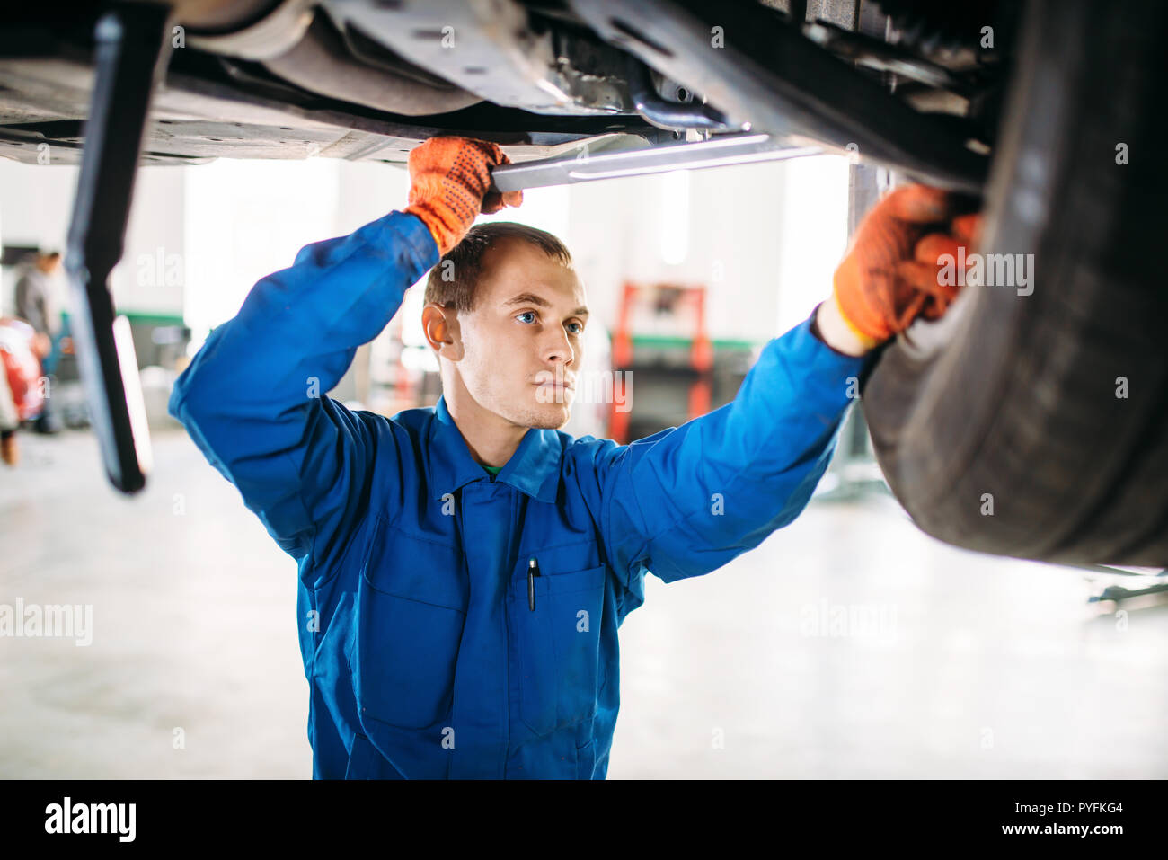 Garage with car repairs on a lift hi-res stock photography and images ...