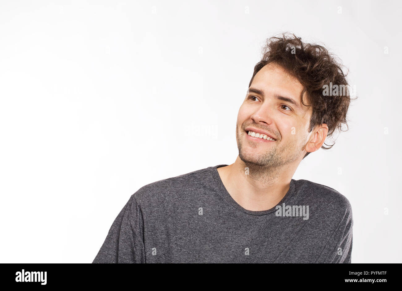 Smiling positive male with attractive look, wearing T-shirt Stock Photo