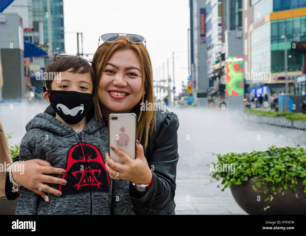 A mother and son take a selfie on holiday at Haeundae in Busan, South Korea. Stock Photo