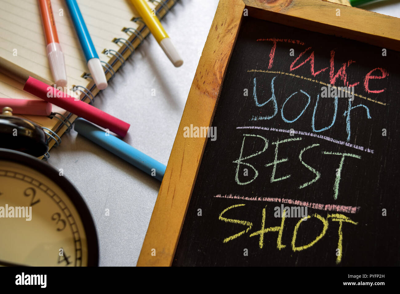 Take your best shot on phrase colorful handwritten on chalkboard, alarm