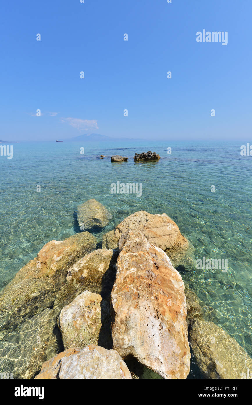 Blue water and rocks - Greece islands coastline Stock Photo - Alamy