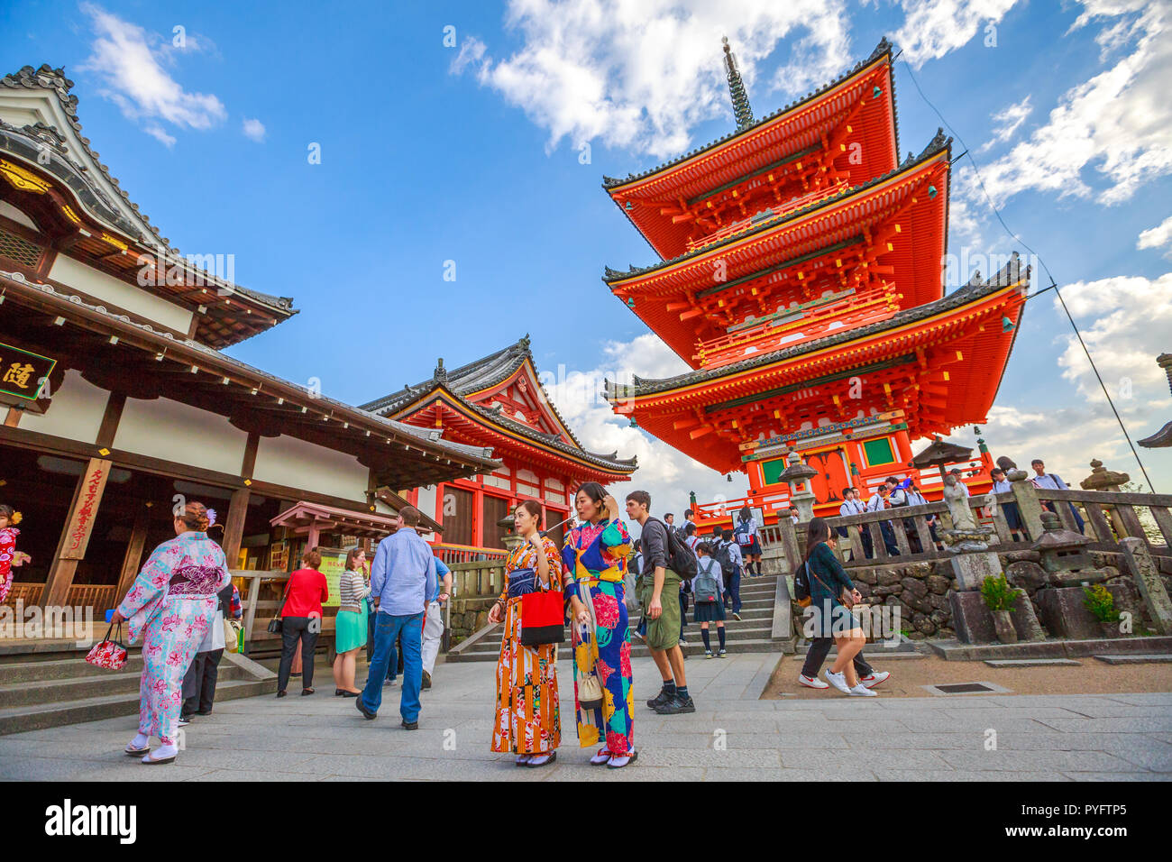 Kyoto, Japan - April 24, 2017: people and women in traditional japanese kimonos walking inside Kiyomizu-dera, Southern Higashiyama, one of the most celebrated temples of Japan. Unesco heritage Site. Stock Photo