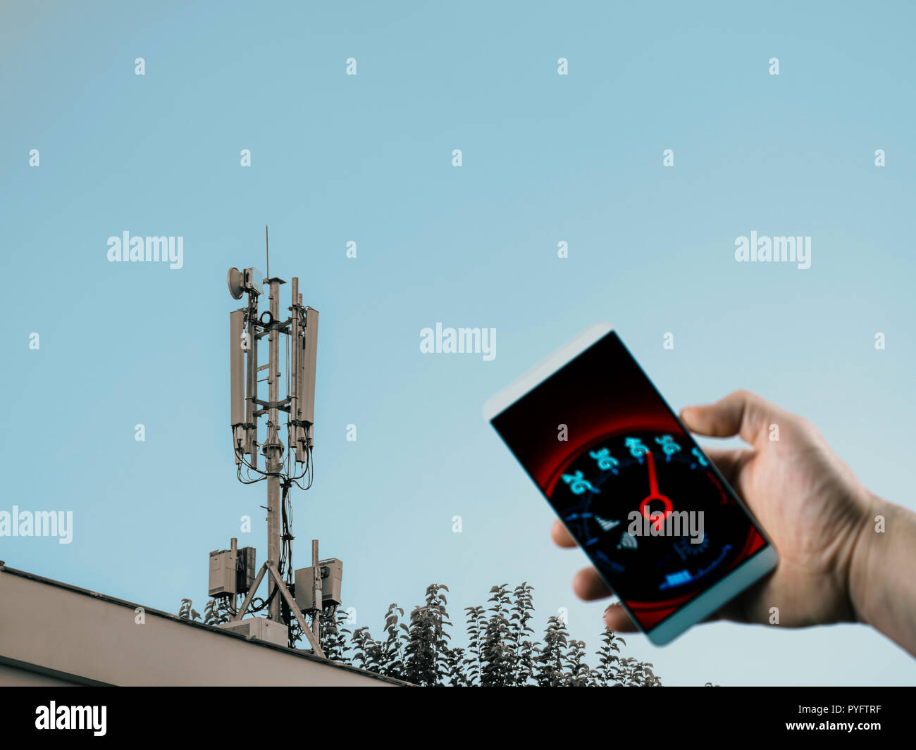 cell phone base station on roof and mobile network speedometer on phone screen Stock Photo Alamy