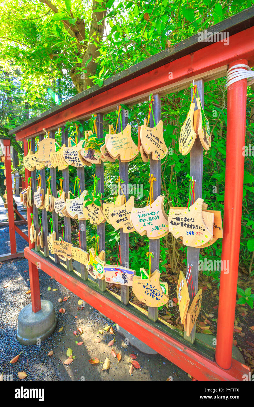 Kamakura, Japan - April 23, 2017: Ema praying tablets at Tsurugaoka Hachiman, the most important Shinto shrine built in 1063 in ancient Japan. Ema are small wooden plaques used for wishes. Stock Photo