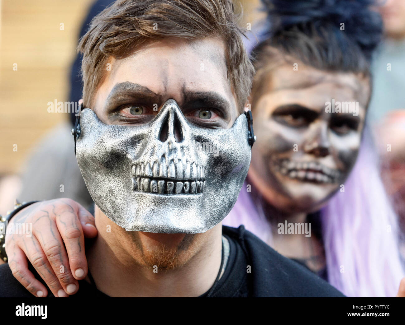 People are seen dressed in zombie costumes and make-up during the celebrations. Hundreds of people marched through the streets in Kiev downtown, on the eve of the Halloween zombie celebrations. Stock Photo