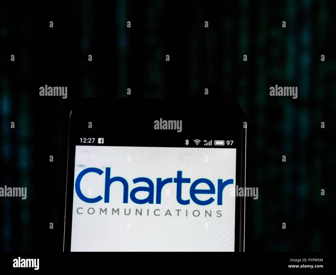 Charter Communications. Telecommunications company logo seen displayed on  smart phone. Charter Communications, Inc. is an American telecommunications  company that offers its services to consumers and businesses under the  branding of Spectrum Stock